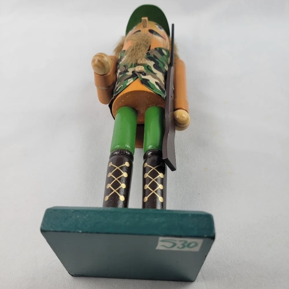 Wooden camouflage nutcracker with a rifle‎